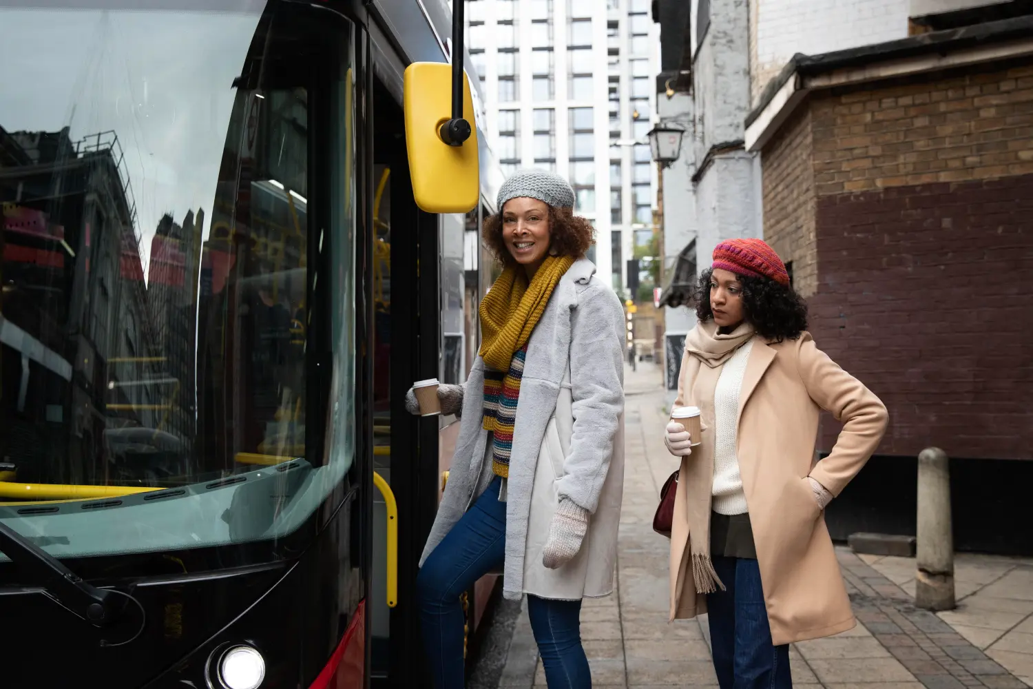 medium-shot-women-walking-with-coffee