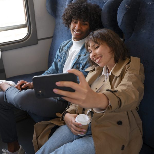 side-view-friends-traveling-by-train
